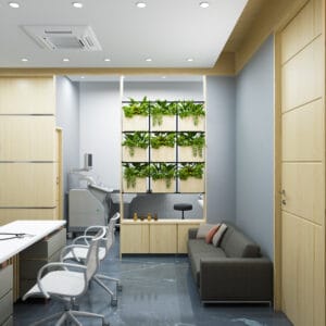 A well-lit gynecologist's clinic consultation space featuring a modern desk setup, decorative sculptures, and vibrant greenery integrated into a functional and aesthetic design.