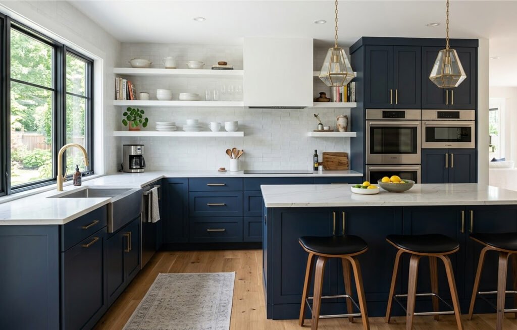 Modern kitchen featuring a two-tone matte cabinetry palette with dark navy base cabinets and airy white upper floating shelves.
